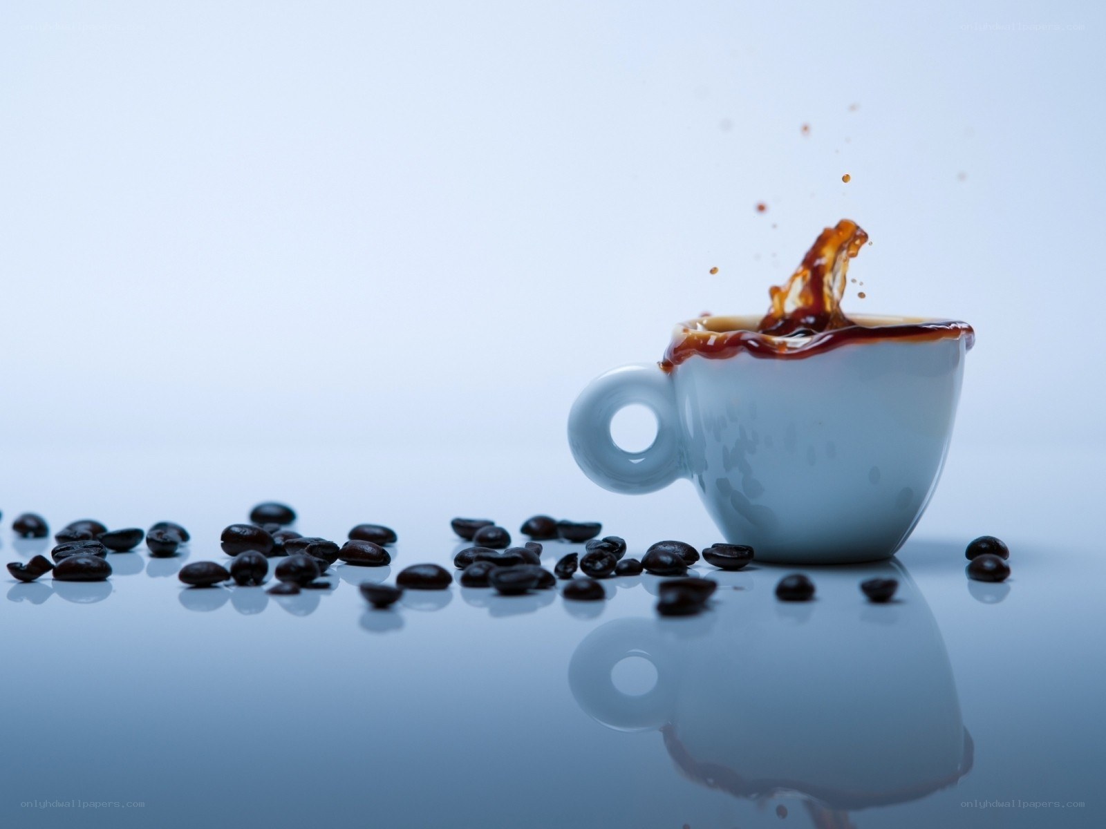 coffee cup splashing beans