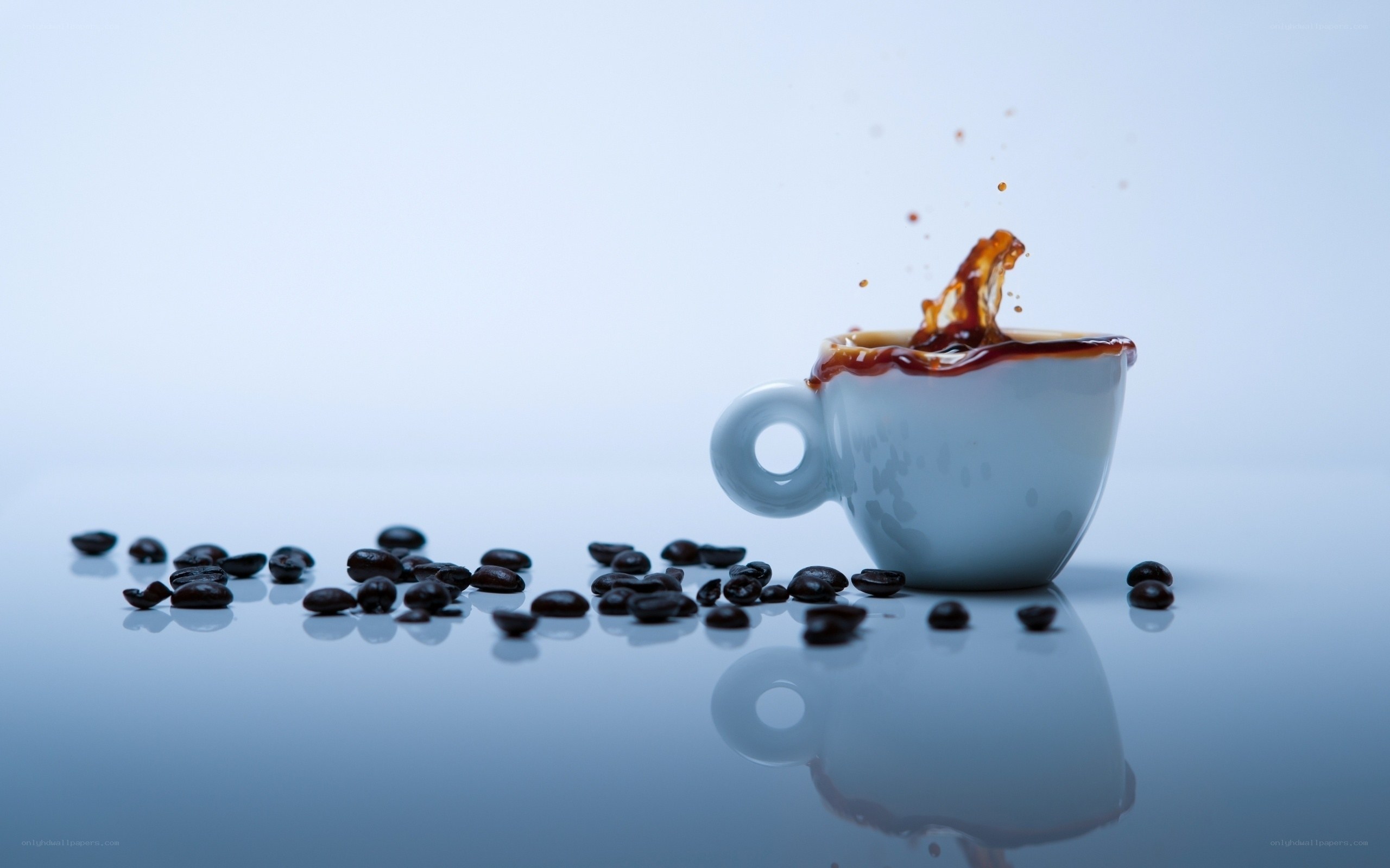 coffee cup splashing beans
