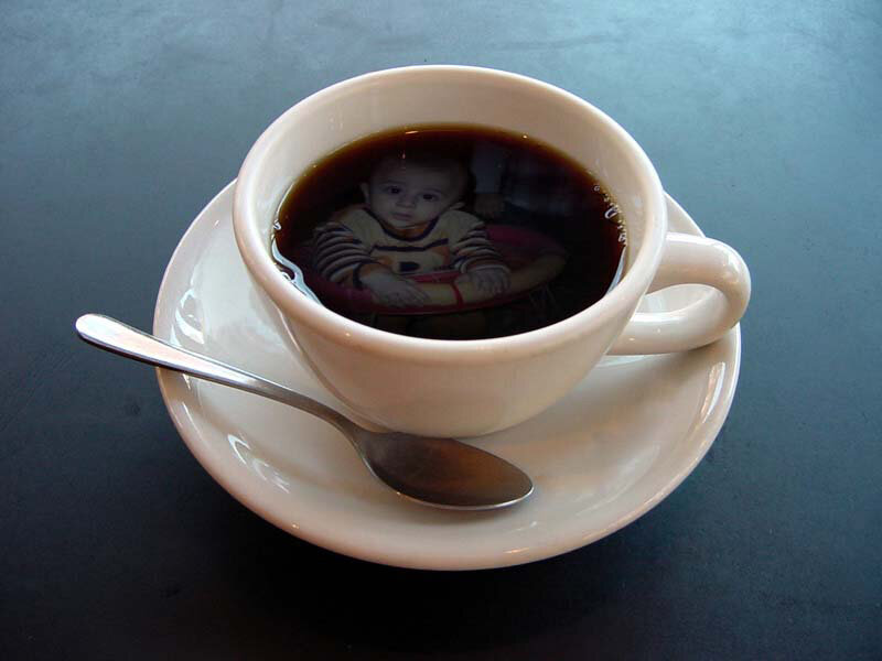 coffee cup with baby reflection