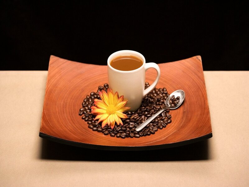 coffee cup with beans and flower