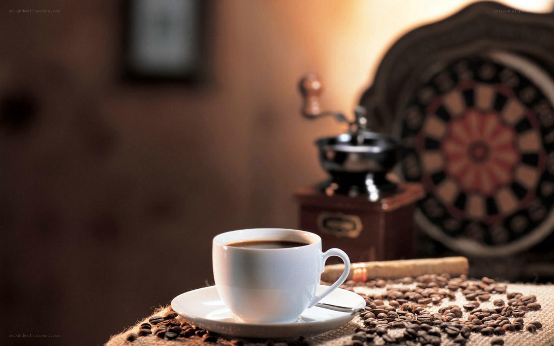 coffee cup with beans and grinder