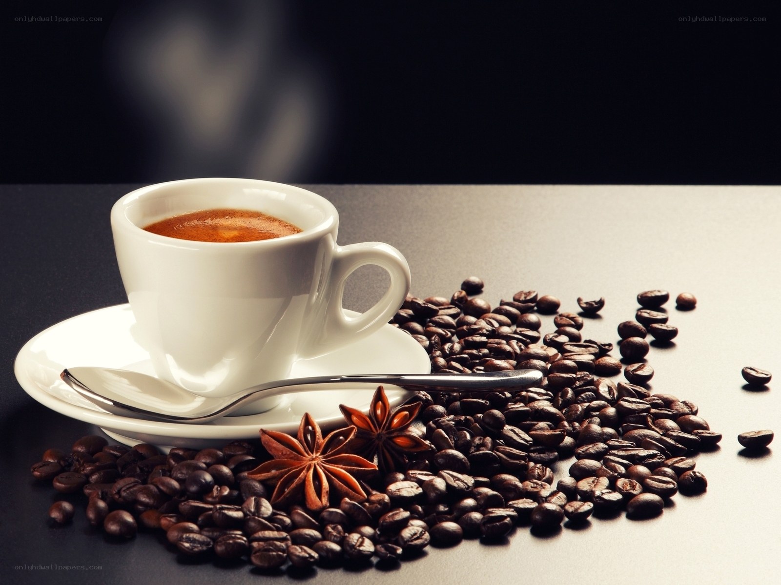 coffee cup with beans and star anise
