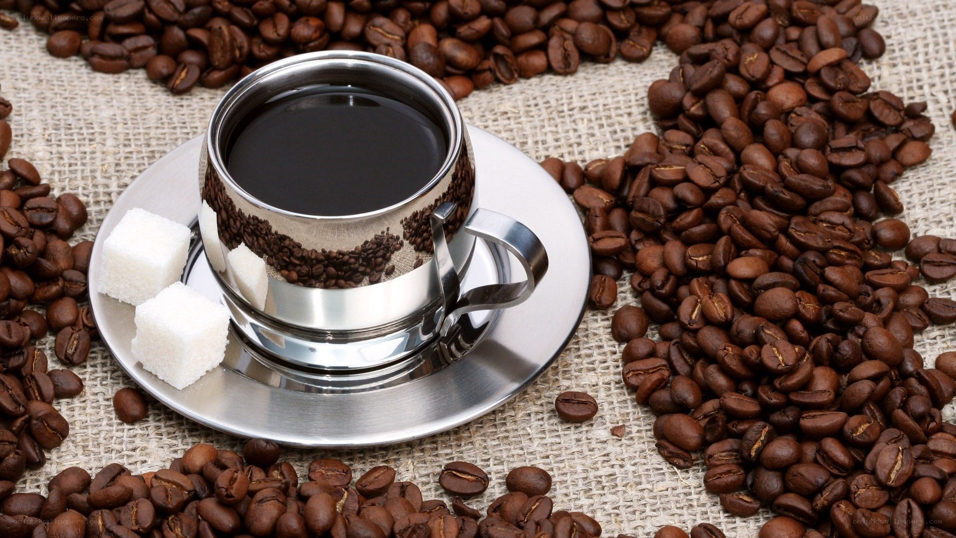 coffee cup with beans and sugar