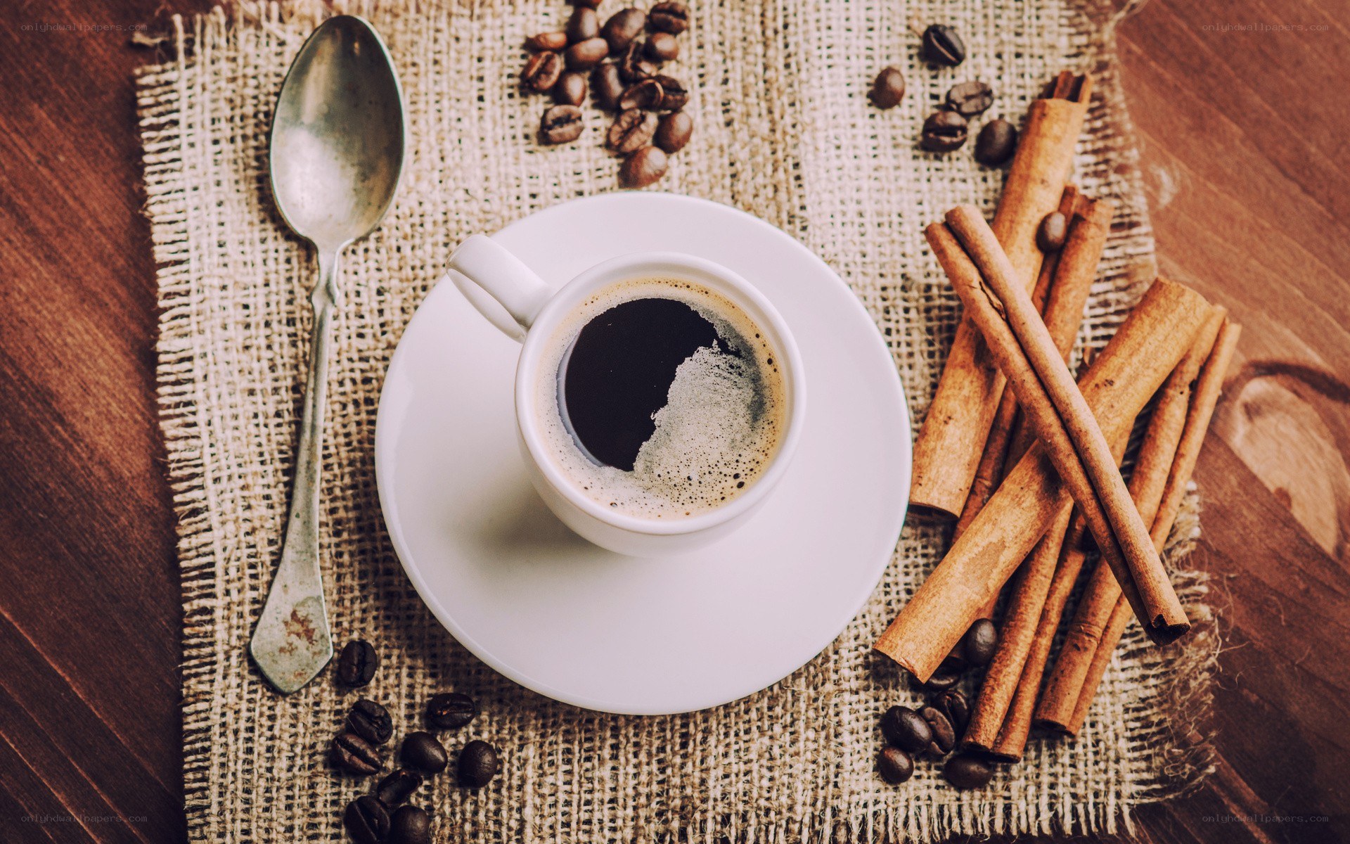 coffee cup with cinnamon sticks