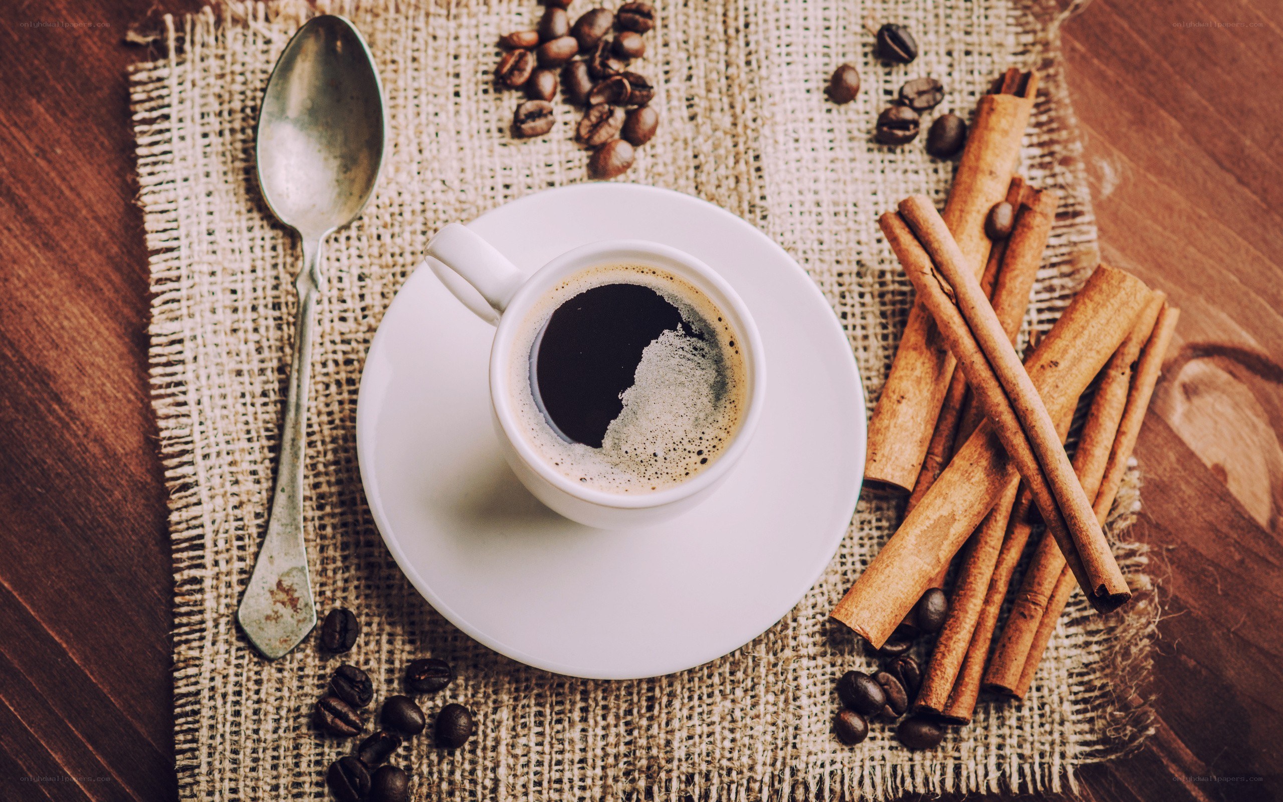 coffee cup with cinnamon sticks