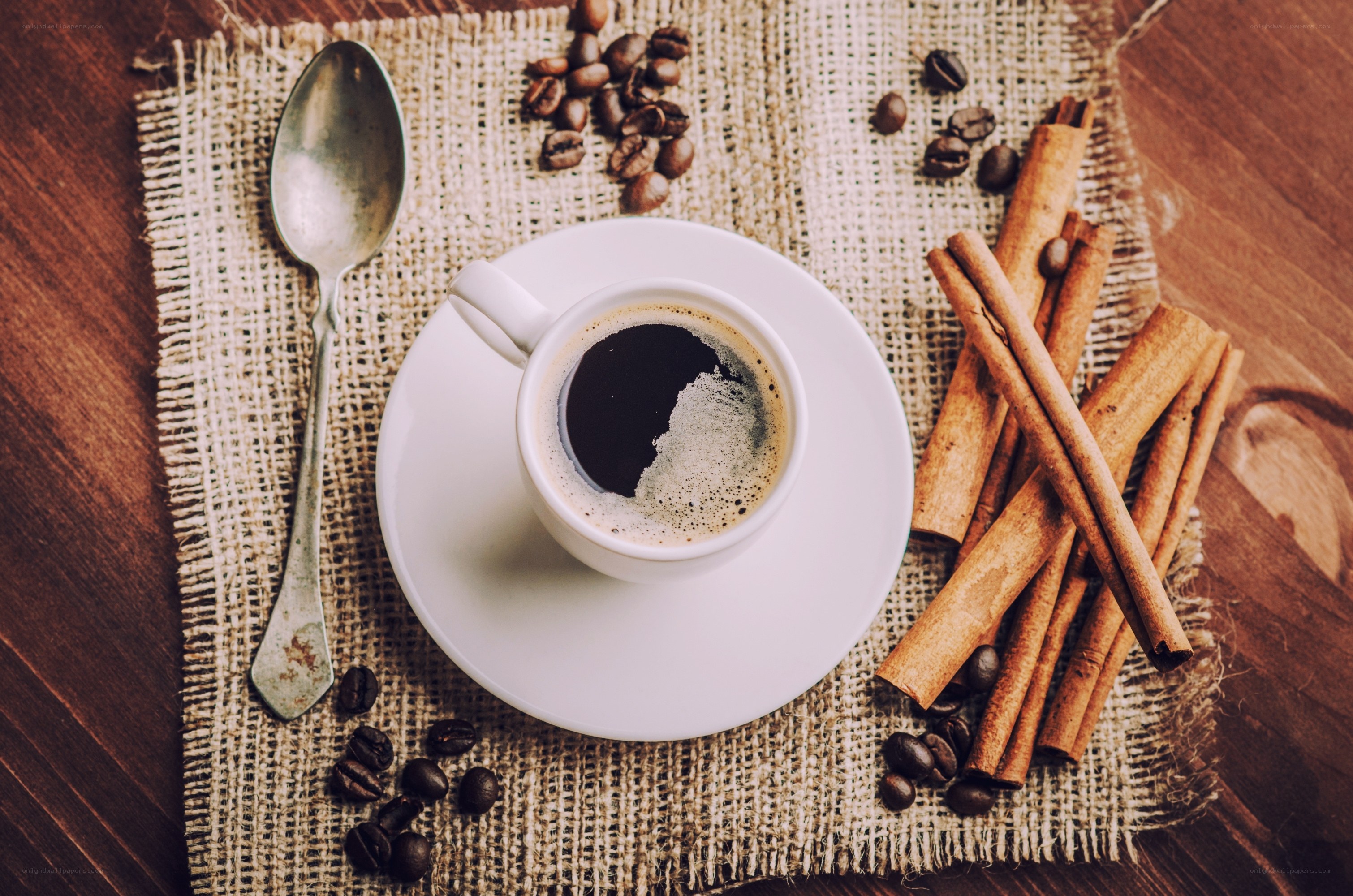coffee cup with cinnamon sticks