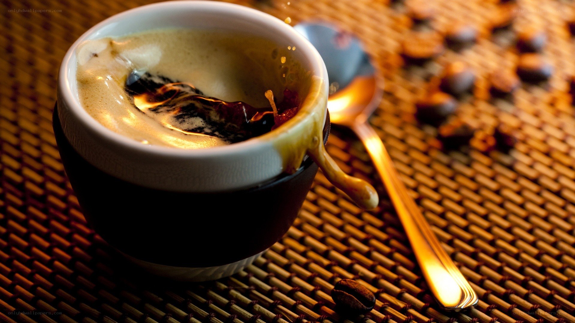 coffee cup with foam and beans