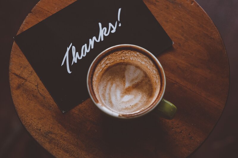 Coffee cup with thanks note