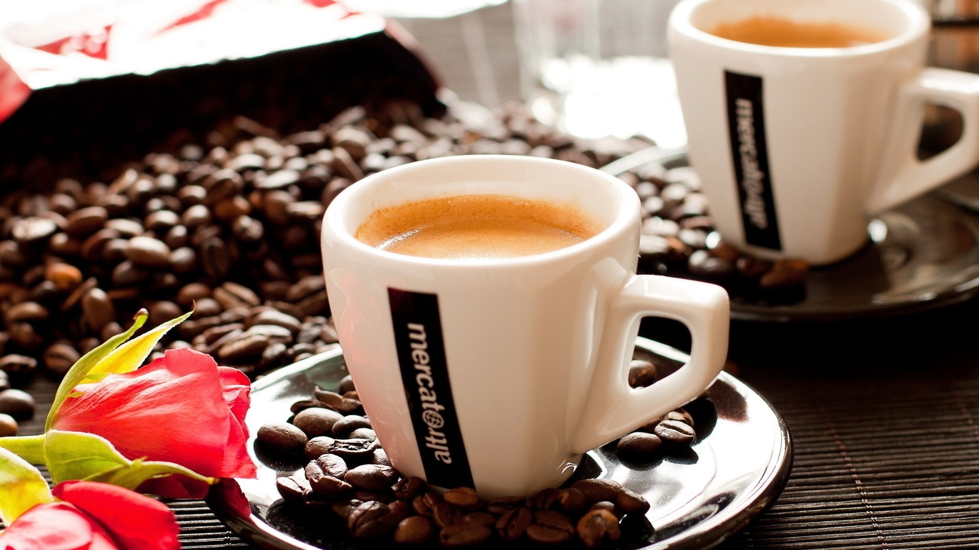 coffee cups with beans and rose