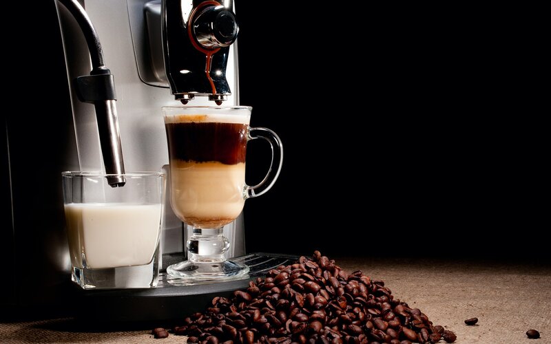 Coffee machine making a latte