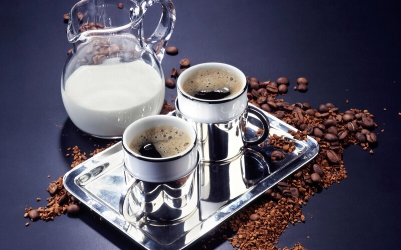 coffee setup with milk and beans