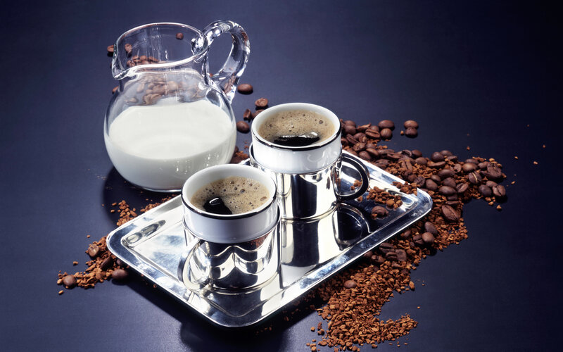 coffee setup with milk and beans