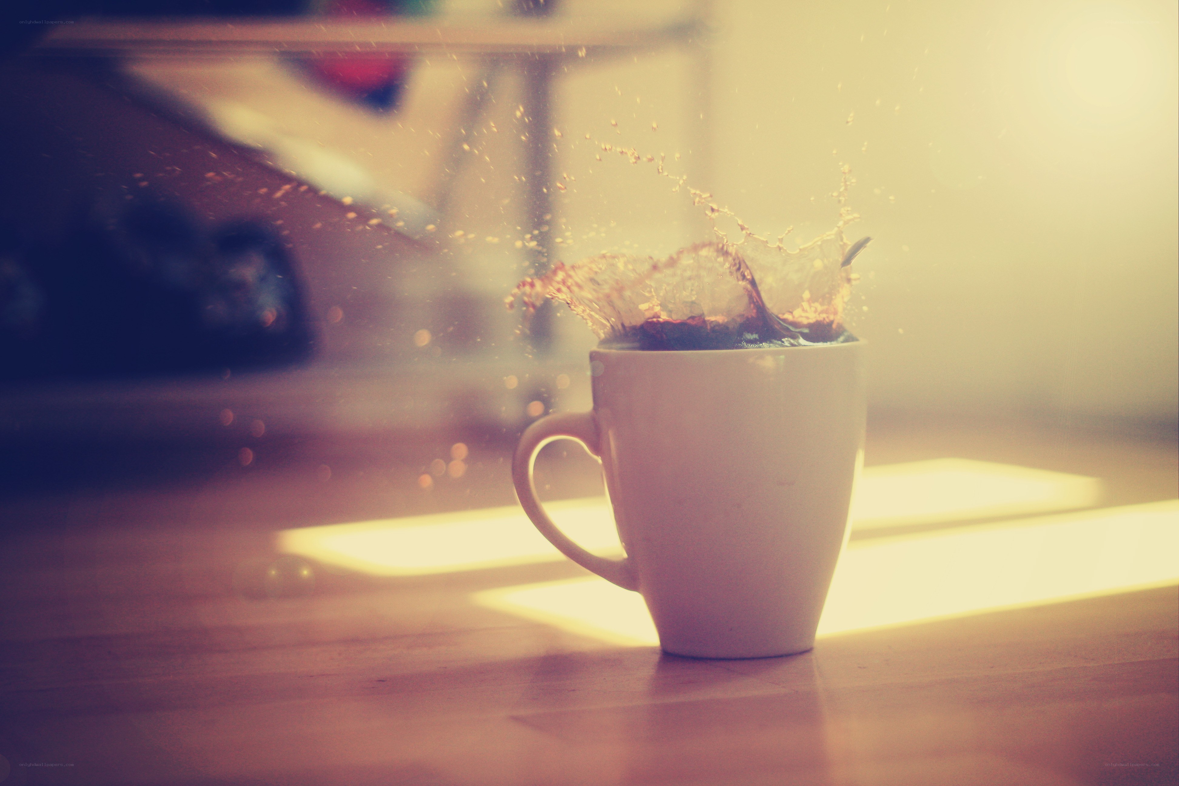 coffee splashing in a mug