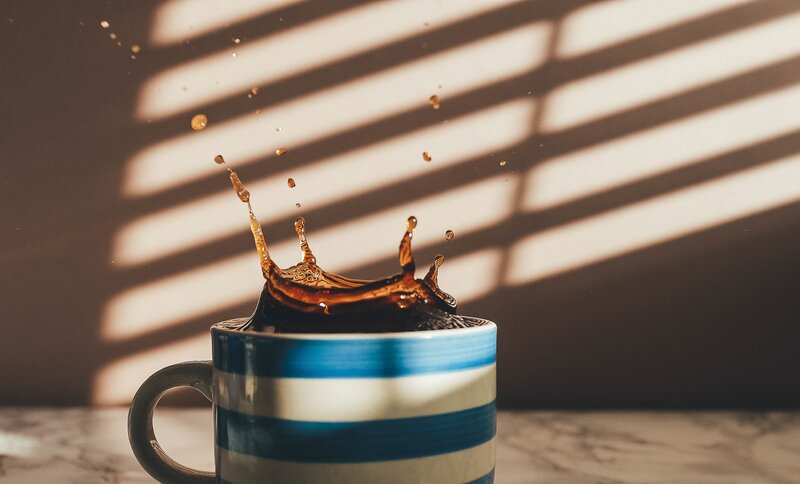 Coffee Splashing in Cup — Blue