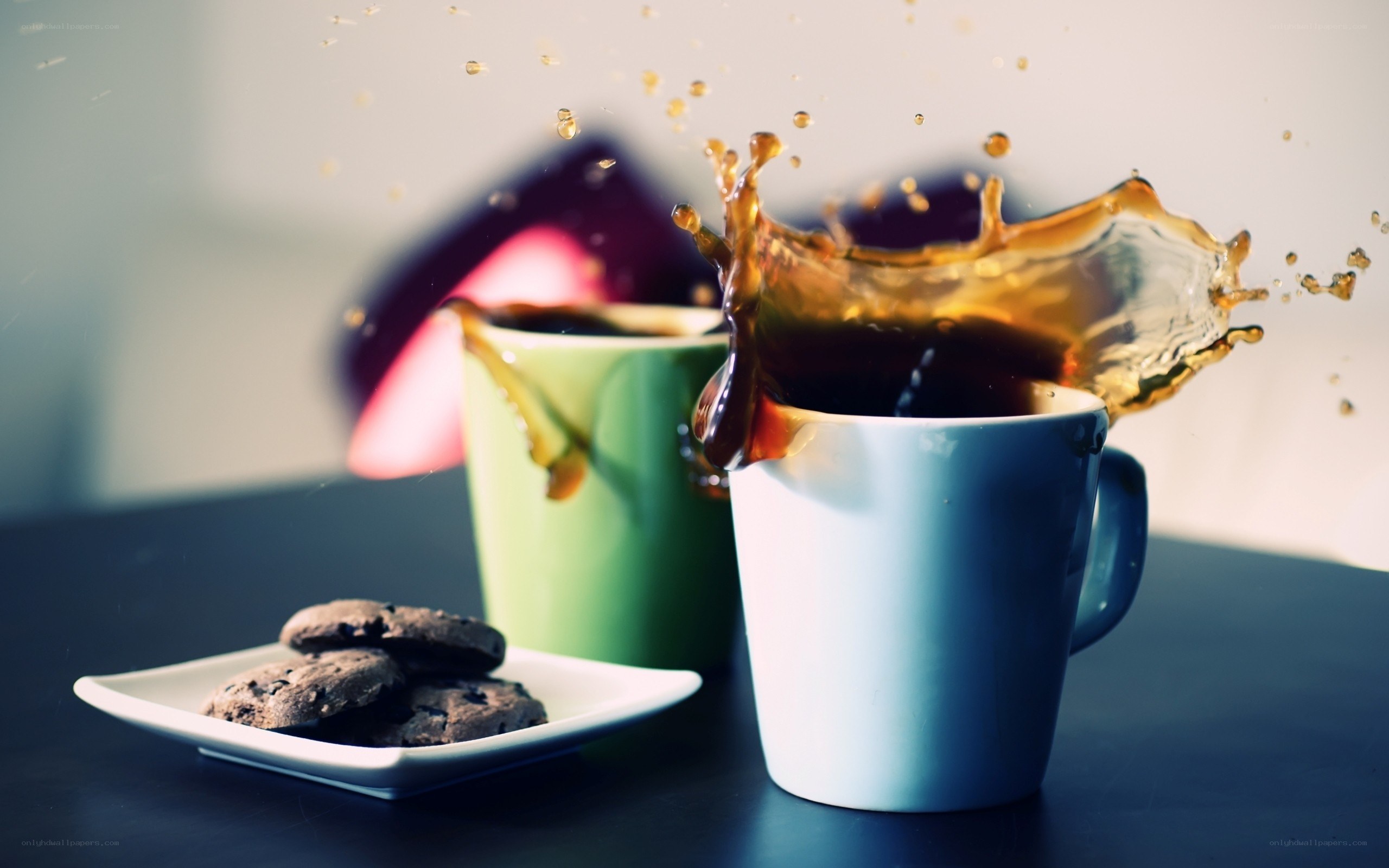 coffee splashing in mugs