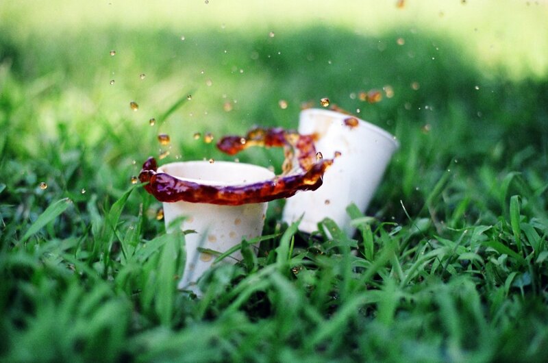 Coffee Splashing on Grass