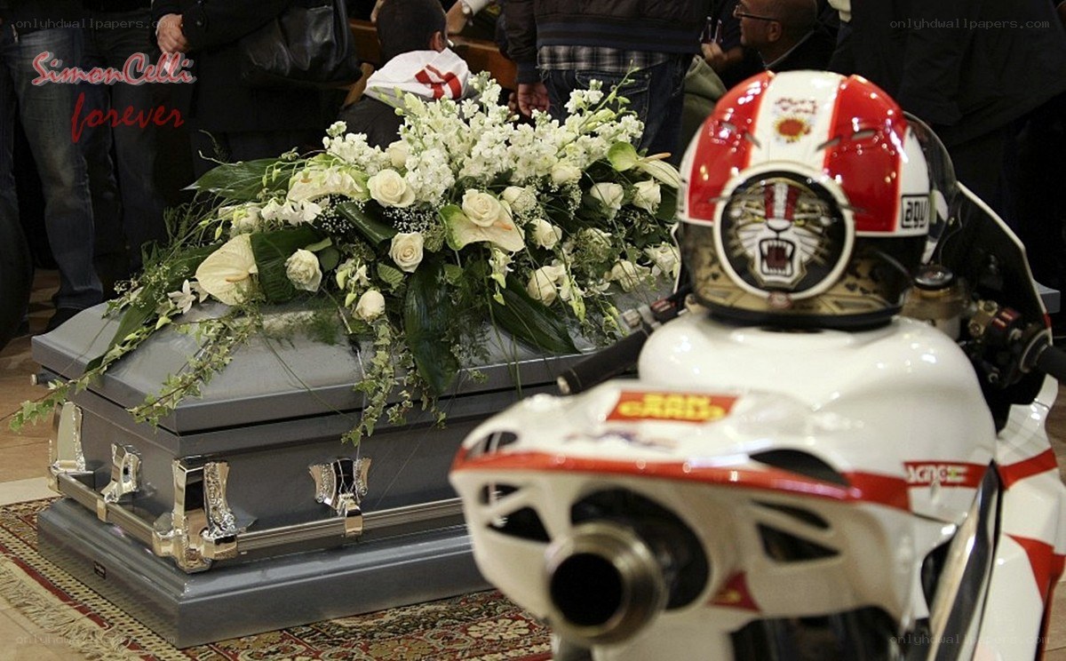 Coffin with motorcycle helmet