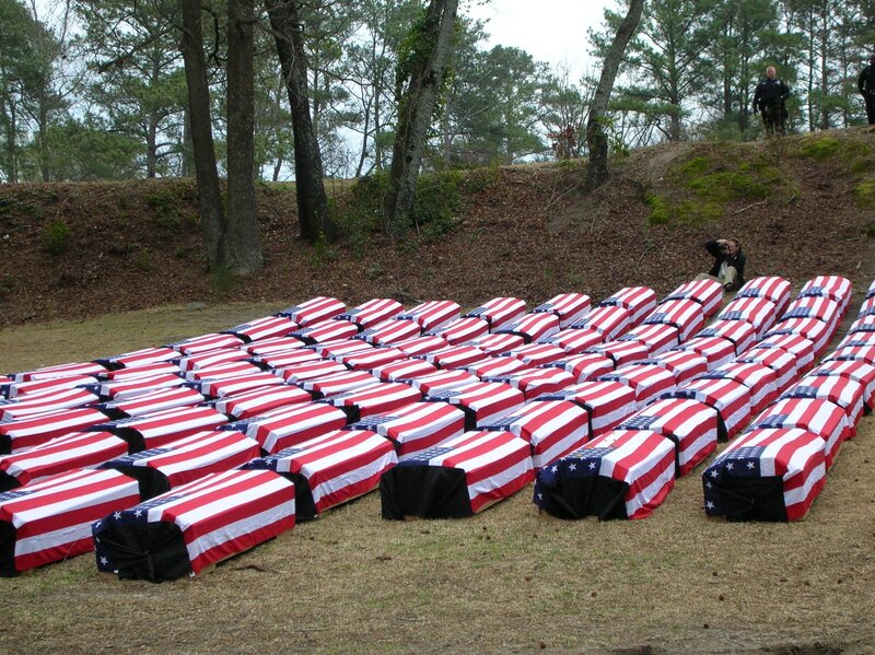 Coffins draped in American flags