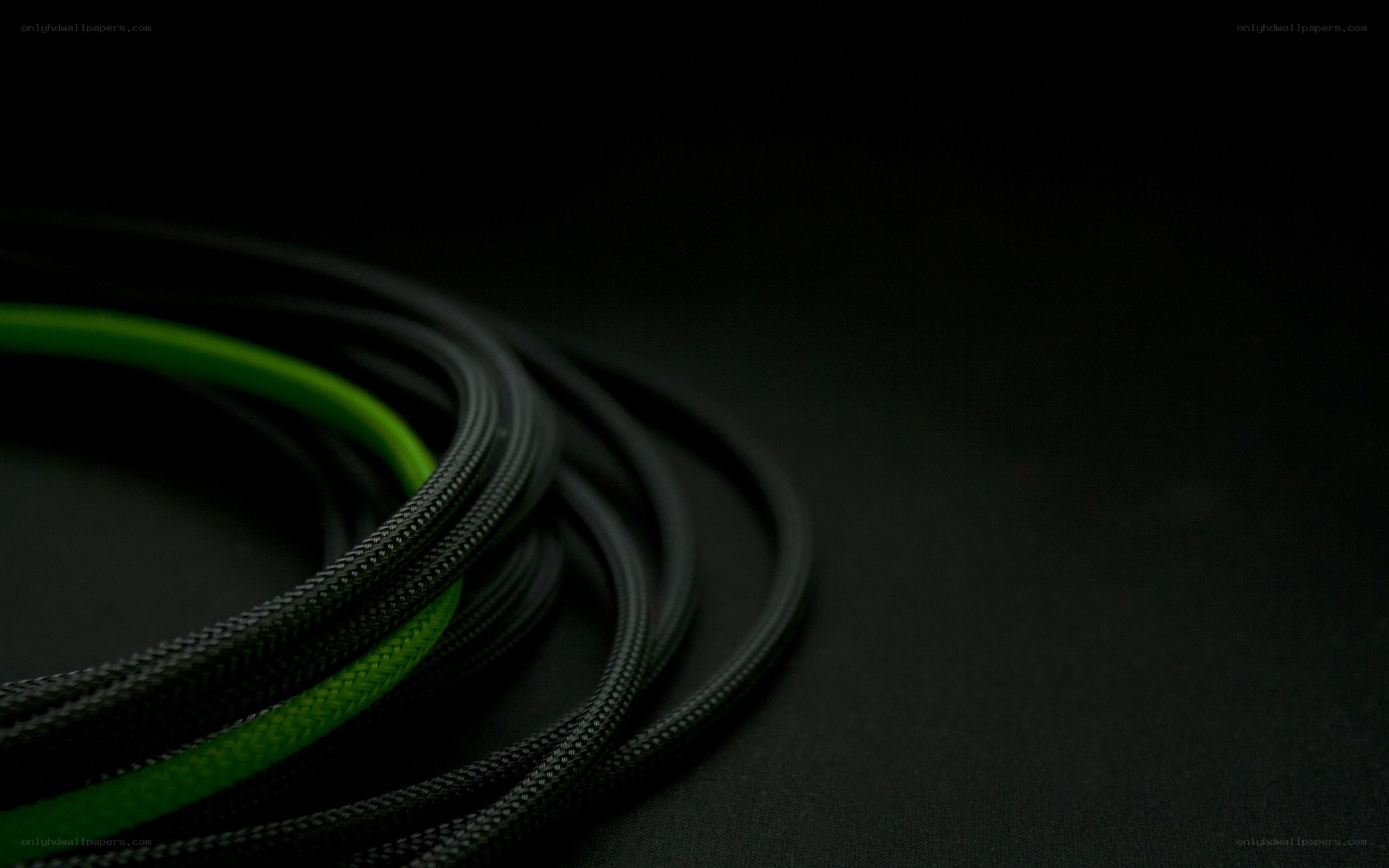 coiled cables on black surface