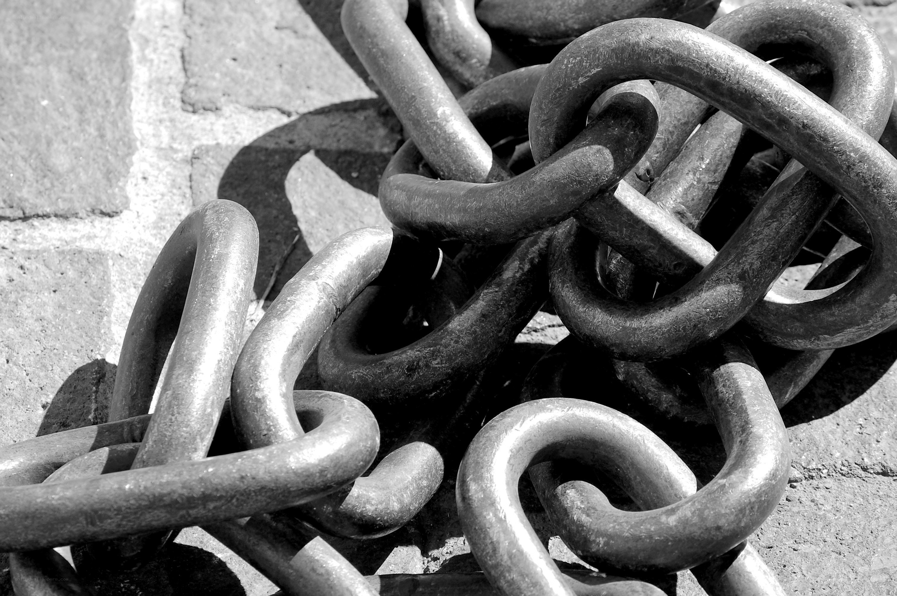 coiled metal chain on pavement