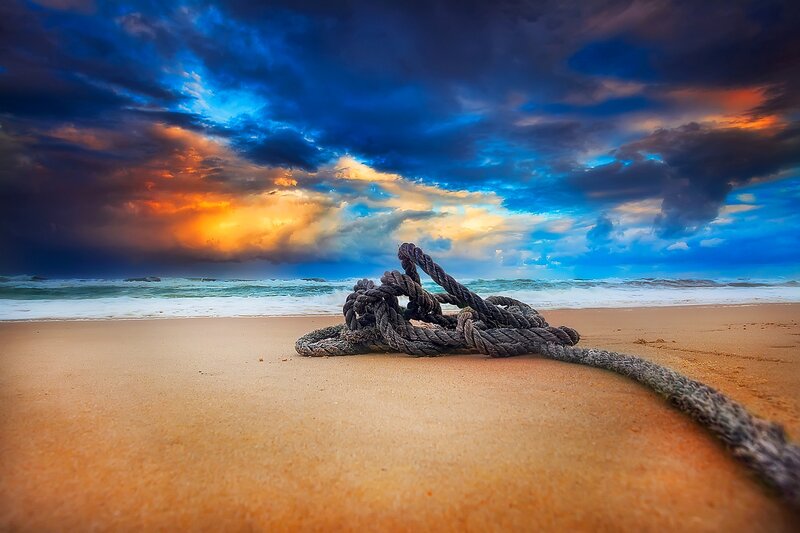Coiled Rope on Beach — Blue