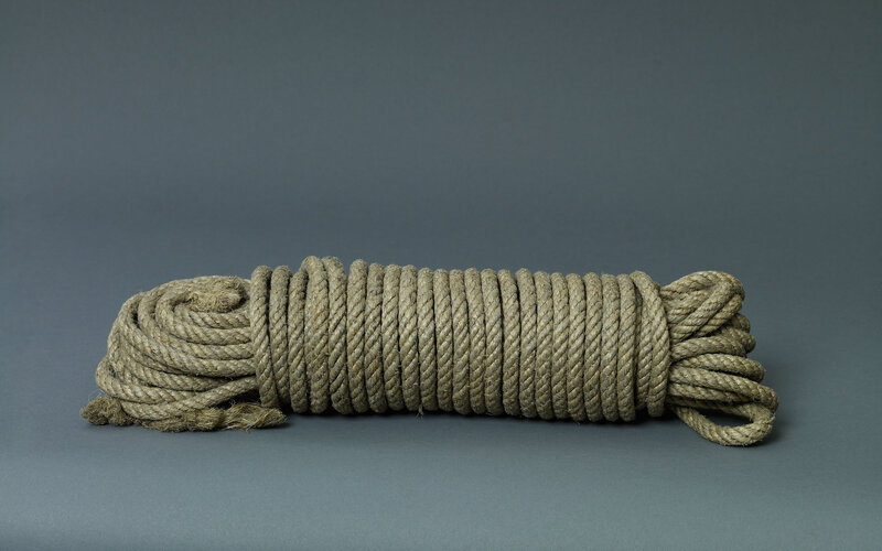 Coiled Rope on Gray Surface