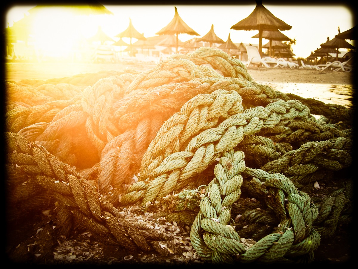 coiled ropes on a beach