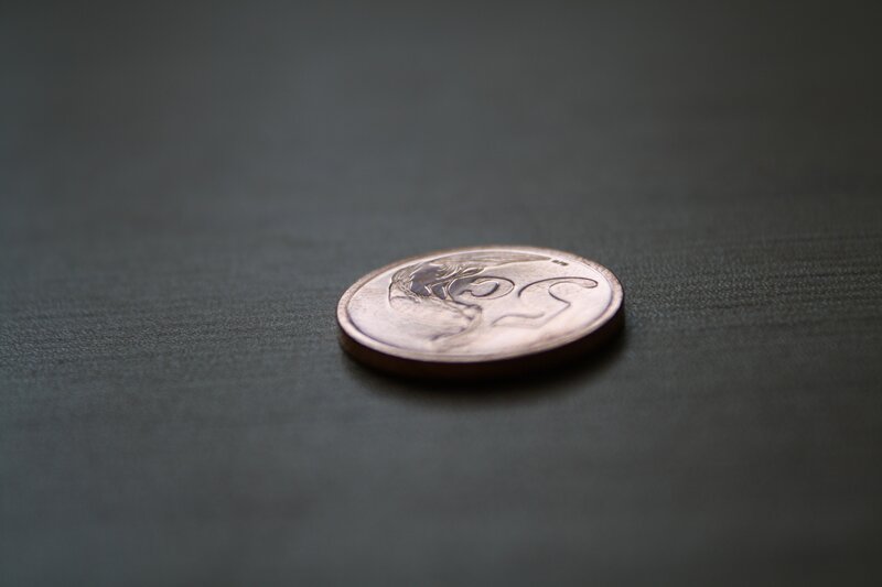 coin on dark surface