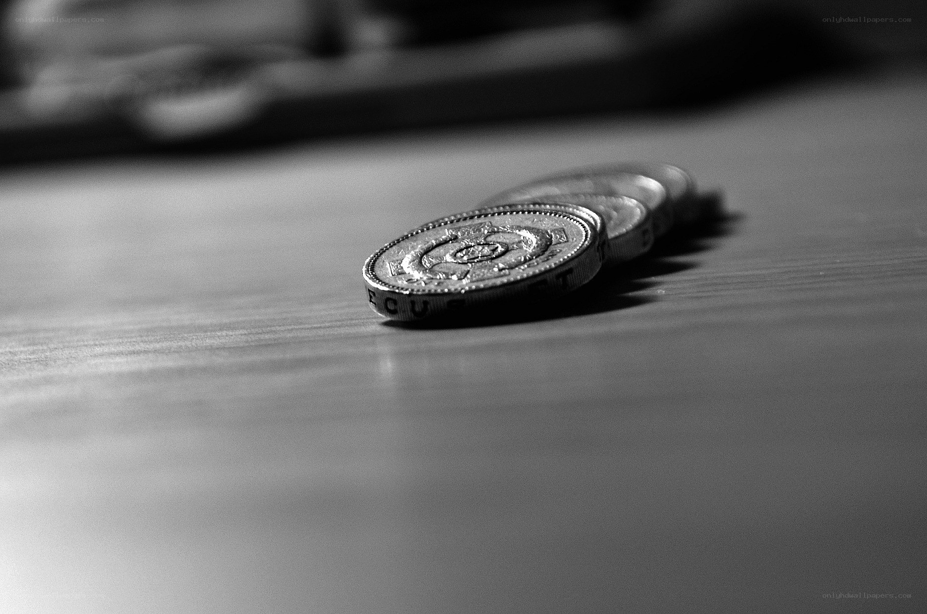 coins on a wooden surface