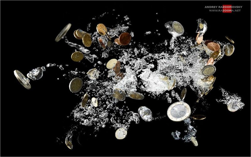 Coins Splashing in Water