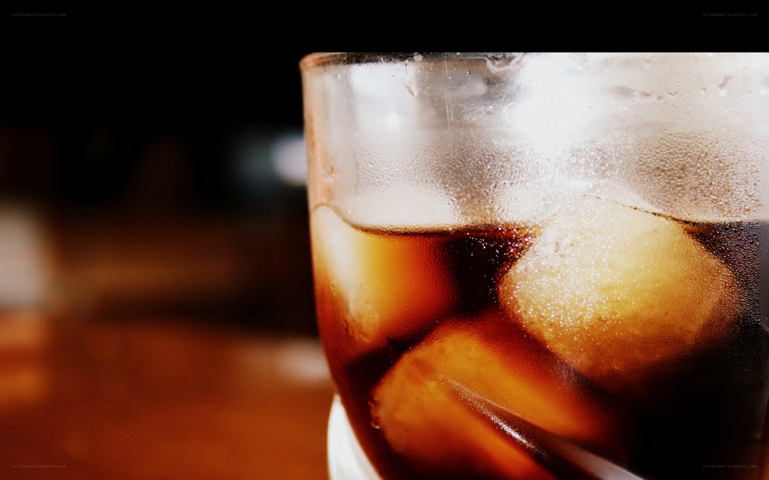 cold cola with ice cubes