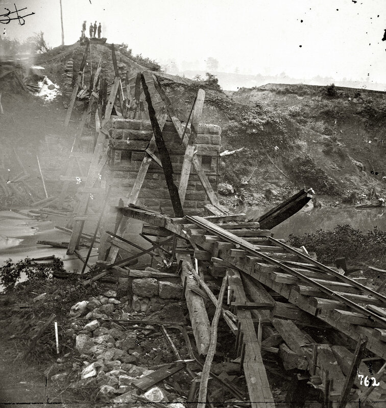 Collapsed bridge over river