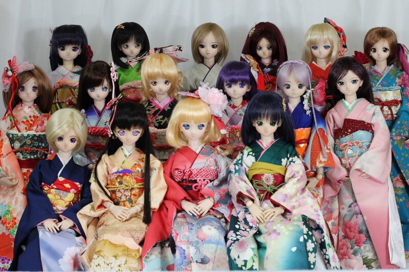 collection of dolls in kimonos