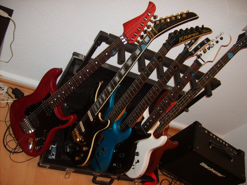 collection of electric guitars
