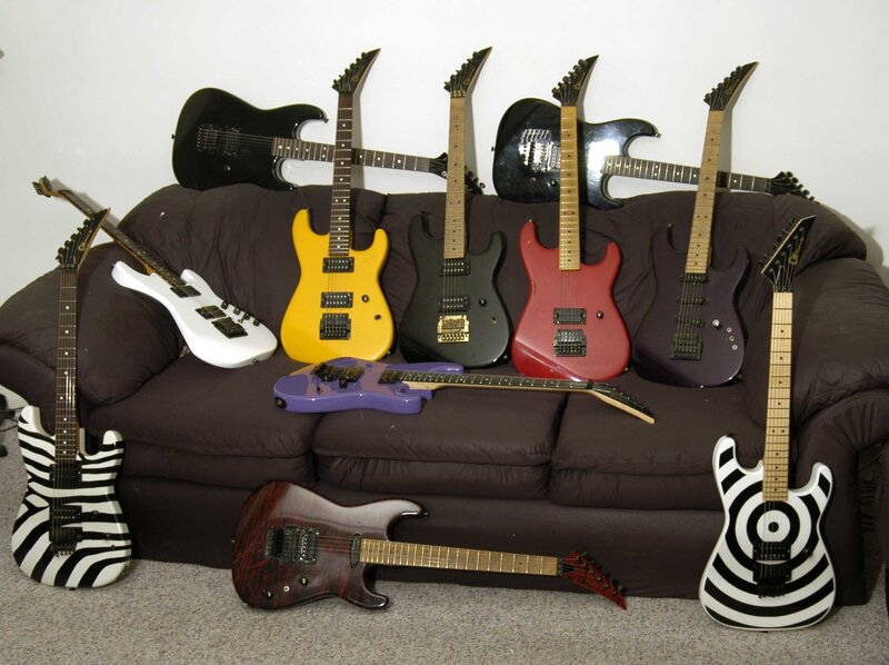 collection of electric guitars