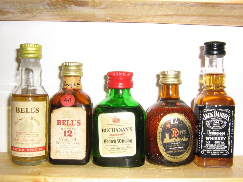 collection of miniature whiskey bottles