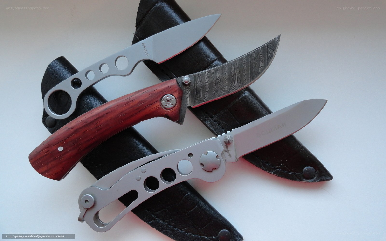 collection of three folding knives