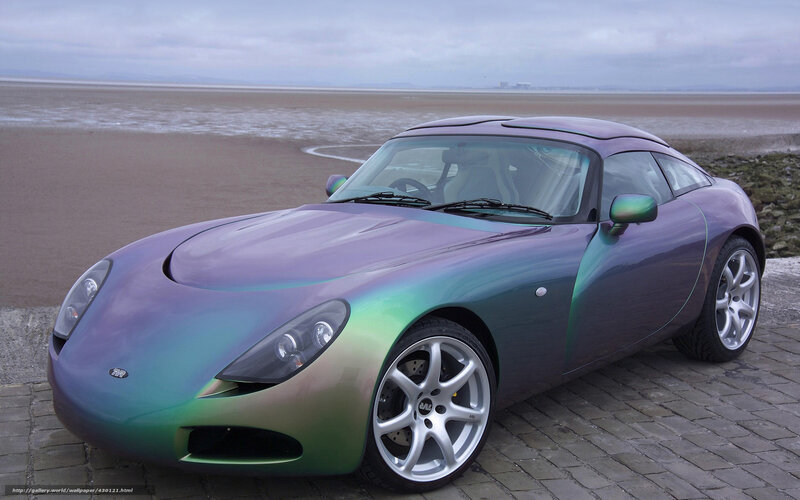 Color-shifting sports car on beach
