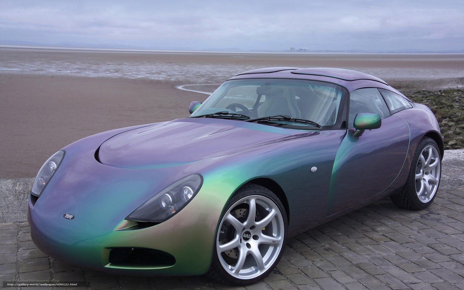 Color-shifting sports car on beach