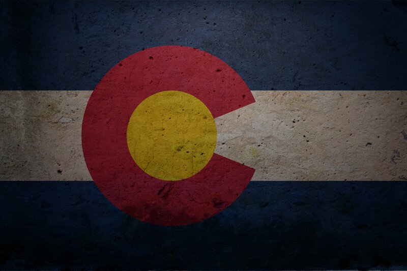 Colorado state flag on textured wall