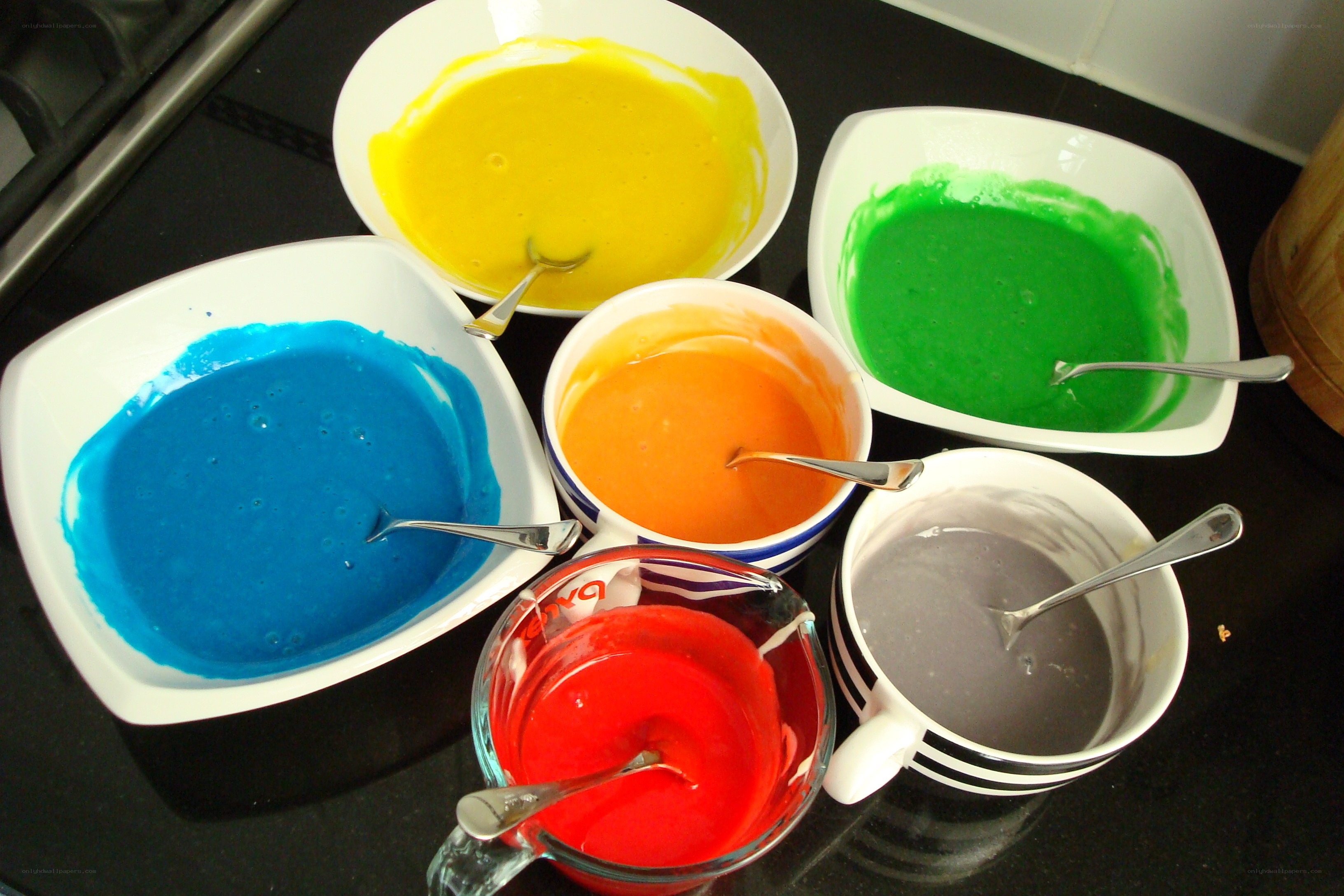 colored batter in bowls