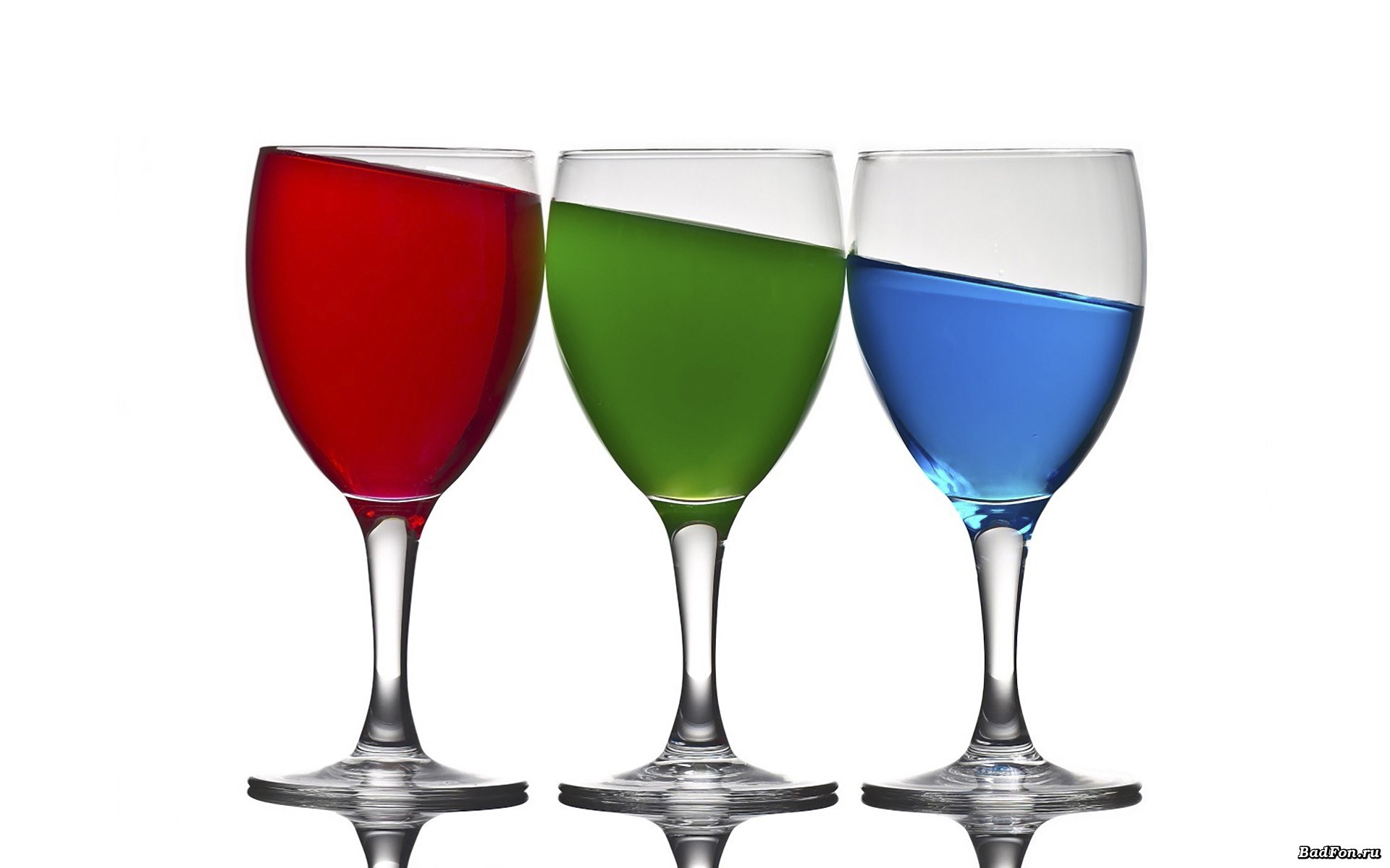 colored liquids in wine glasses