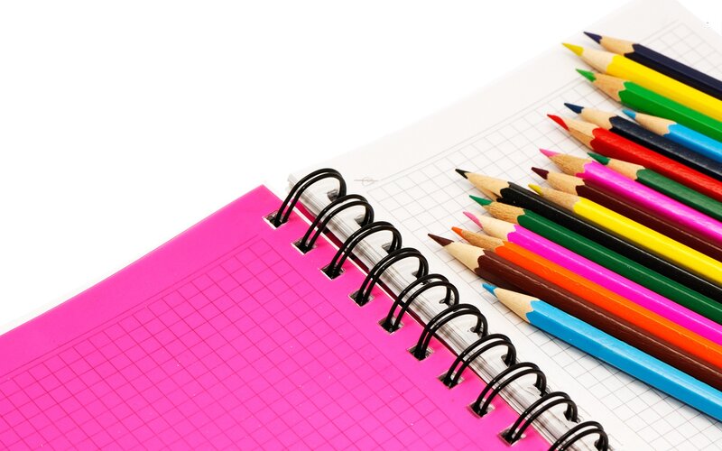 colored pencils and notebook
