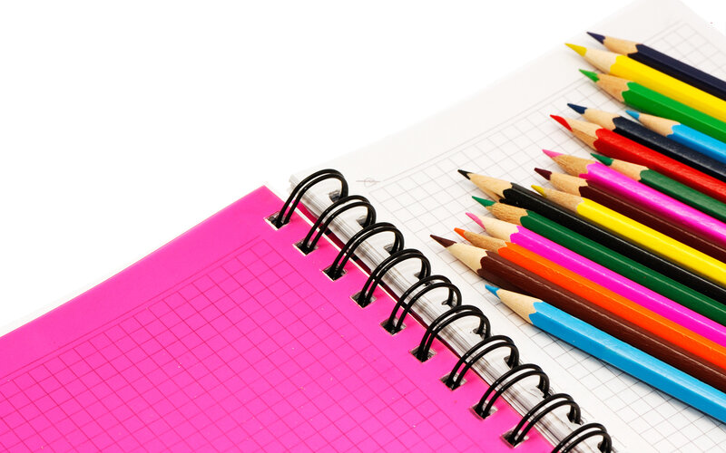 colored pencils and notebook
