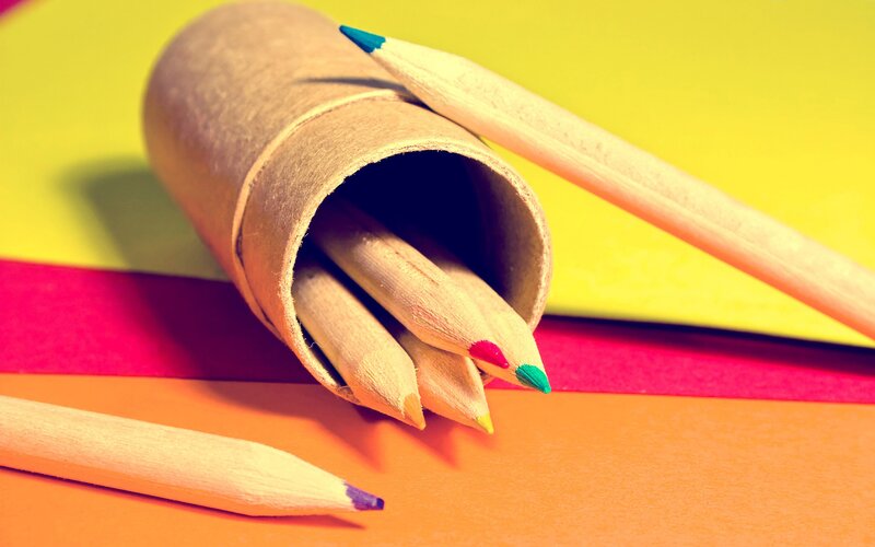 Colored pencils in a cardboard tube