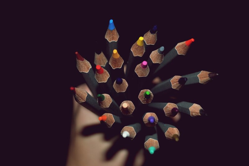 Colored Pencils in Hand — Black