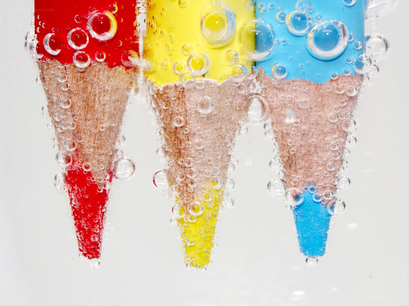 Colored pencils in water