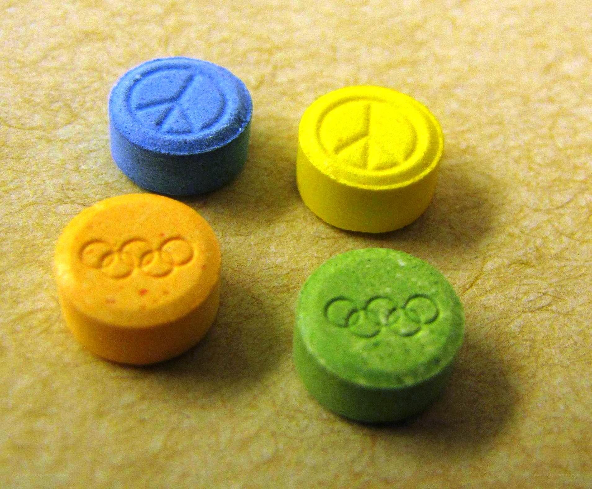 colored pills with symbols