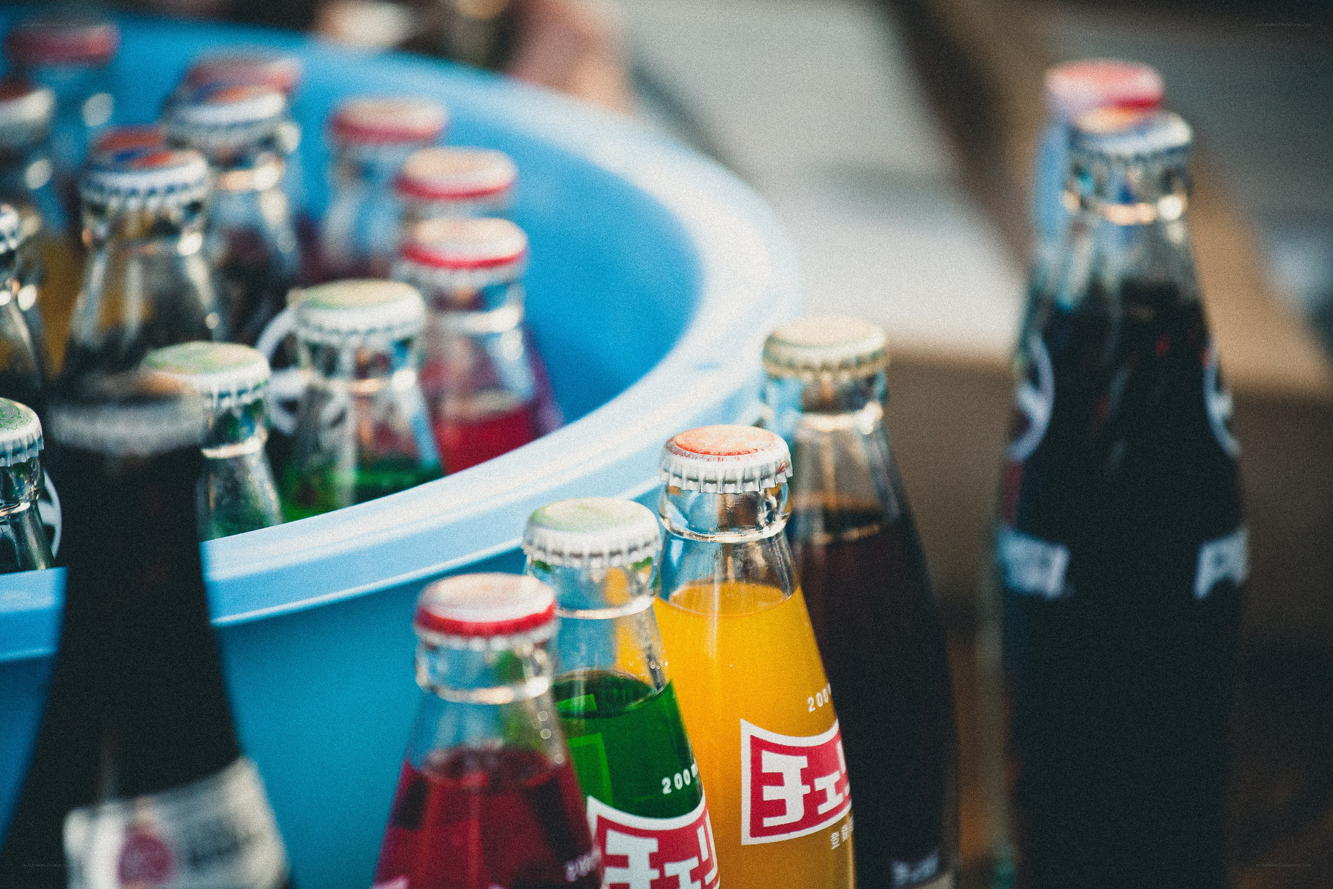 Colored soda bottles in a cooler