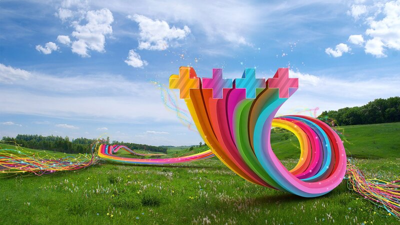Colorful abstract sculpture in a field